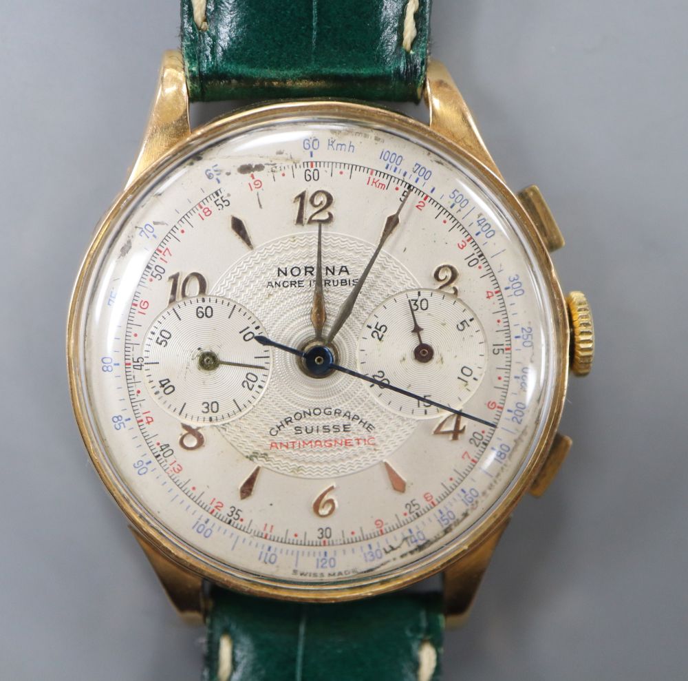 A gentlemans 1950s? 18k Norina chronograph manual wind wrist watch, on later strap.